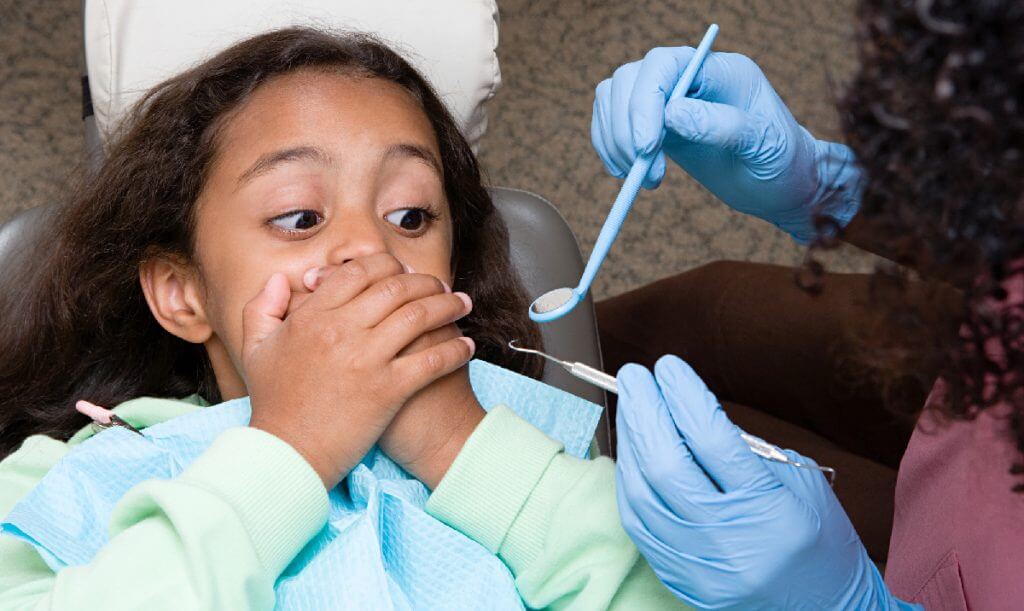 Girl overcoming Fear of the dentist tooth fairy Smiles Blog